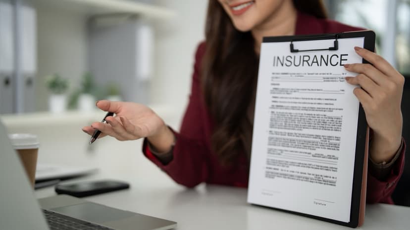 Insurance professional presenting policy documentation