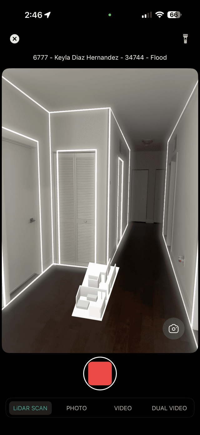 Estimatics iOS app LiDAR scanning a hallway with geometry lines highlighting walls and openings
